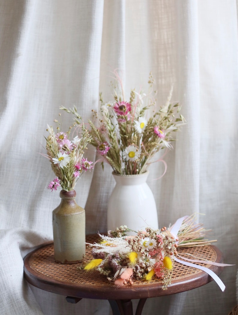 Wildflower dried flower bouquet, with locally sourced green oats, white and pink rhodanthe stems.